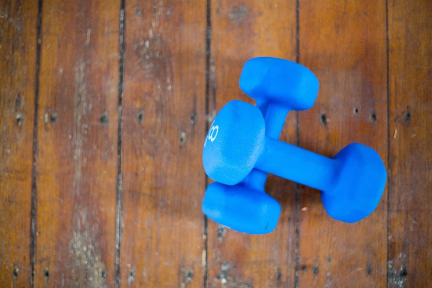 A dumbbell on a wooden floor